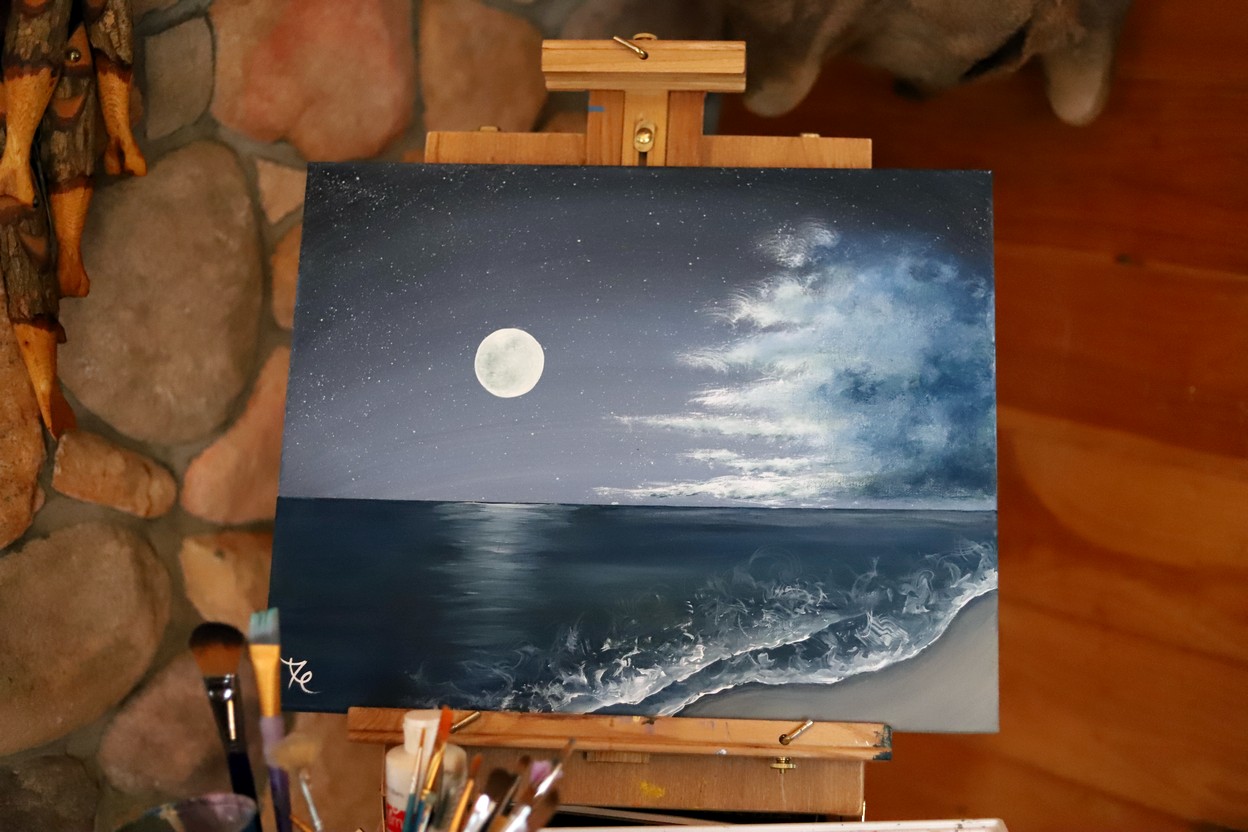 moon over ocean painting
